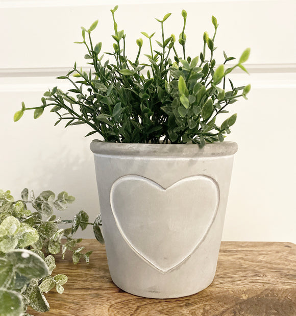 Grey cement planter with embossed heart shape