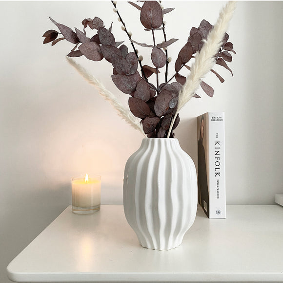 Tall White wave ceramic vase with red eucalyptus 
